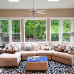 View of 5 vinyl windows inside a living room with a large couch